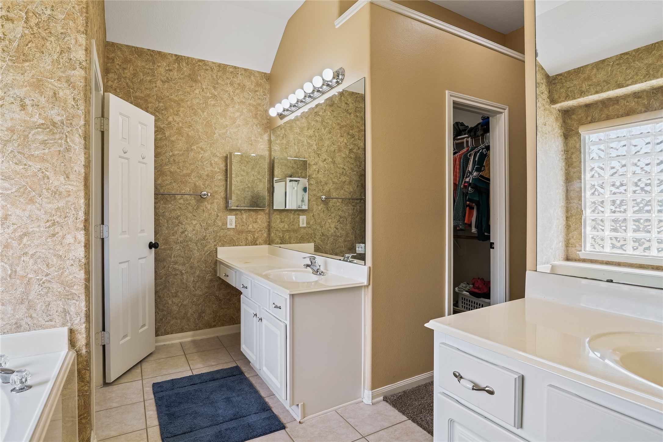 5710 Shady Hollow Court Rosharon, TX 77583 - Photo 17 of 25 a bathroom with a sink a mirror and a shower