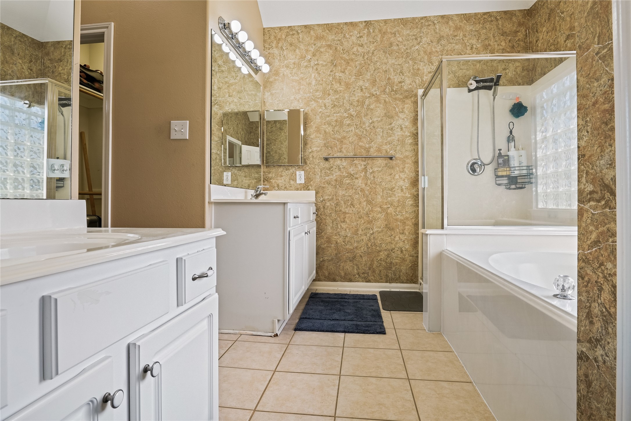 5710 Shady Hollow Court Rosharon, TX 77583 - Photo 18 of 25 a bathroom with a granite countertop sink a toilet a mirror and shower