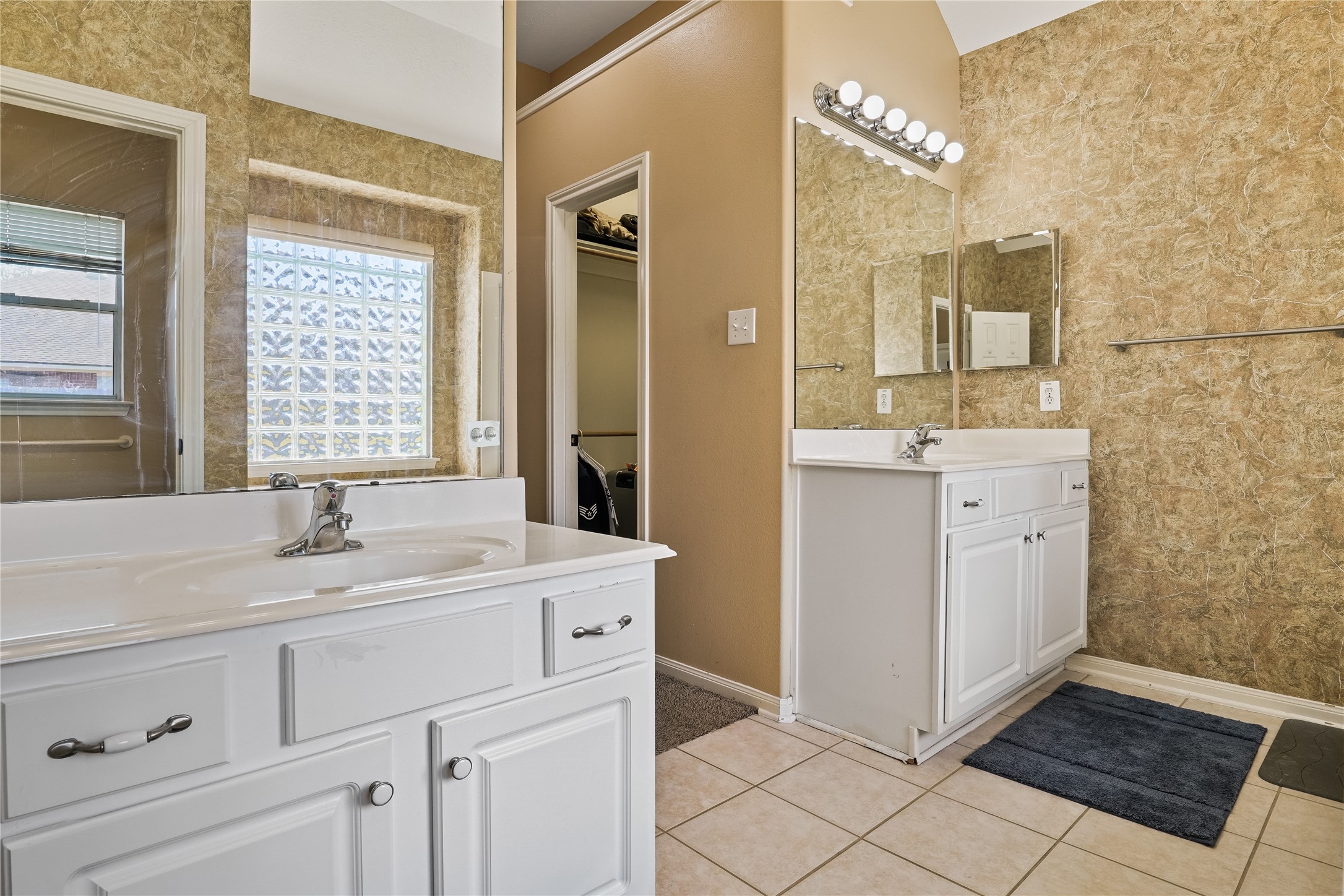 5710 Shady Hollow Court Rosharon, TX 77583 - Photo 19 of 25 a spacious bathroom with a sink a mirror and a shower