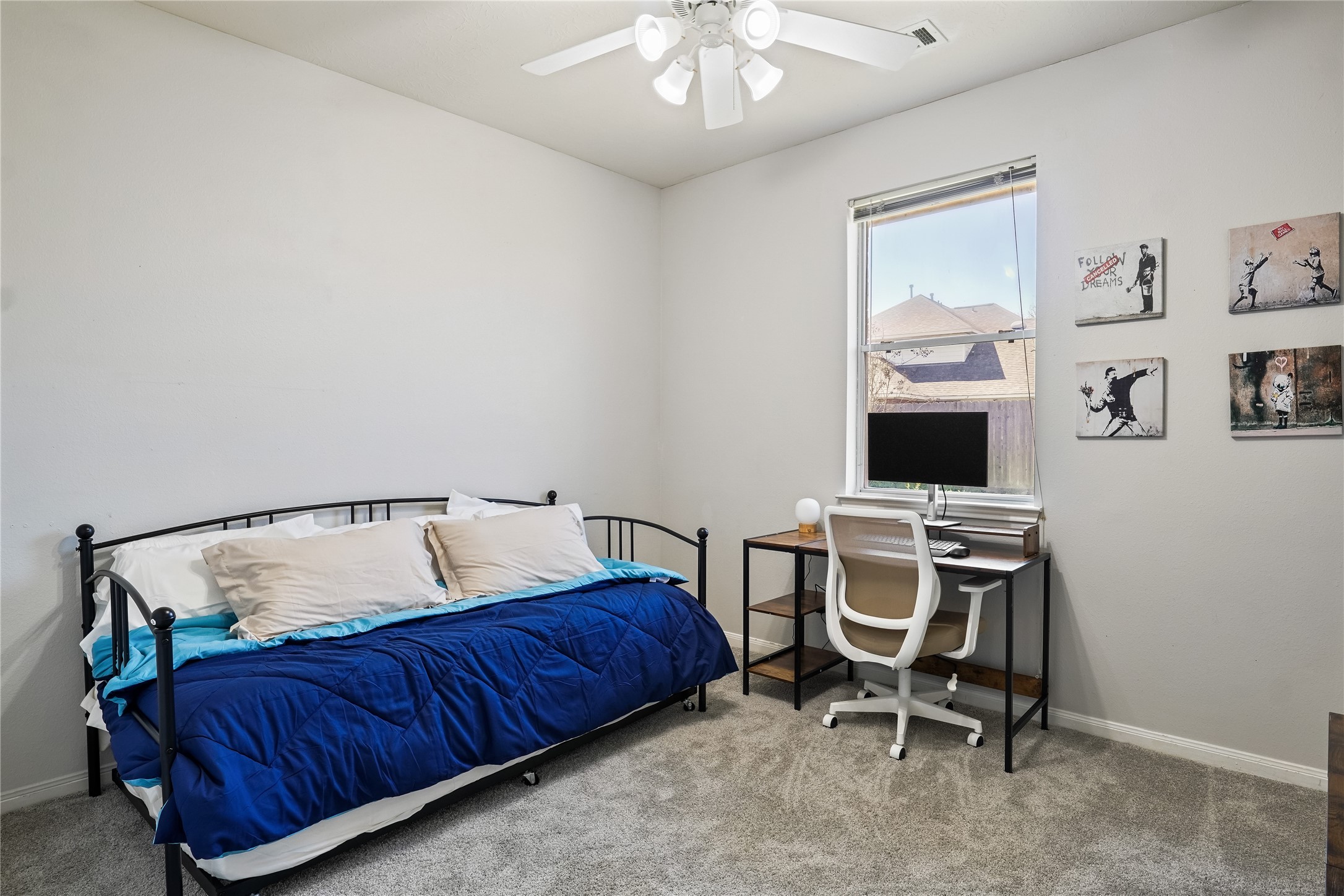 5710 Shady Hollow Court Rosharon, TX 77583 - Photo 21 of 25 a living room with a bed furniture and a flat screen tv