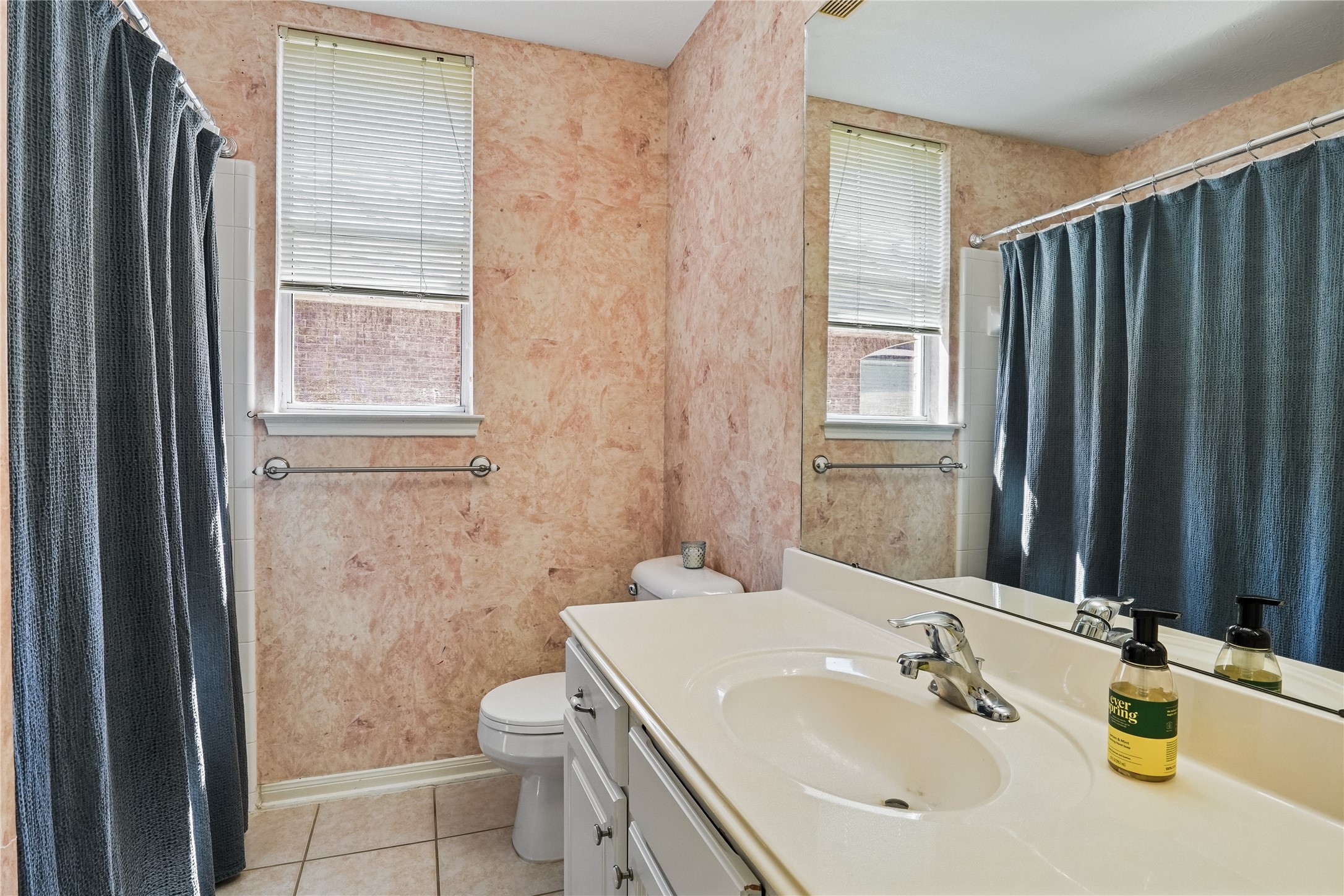 5710 Shady Hollow Court Rosharon, TX 77583 - Photo 22 of 25 a bathroom with a sink a toilet and shower