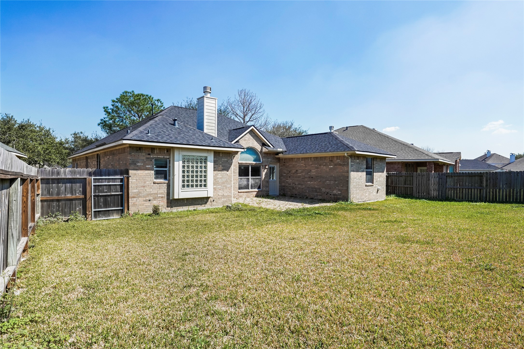 5710 Shady Hollow Court Rosharon, TX 77583 - Photo 23 of 25 a front view of a house with a garden and yard