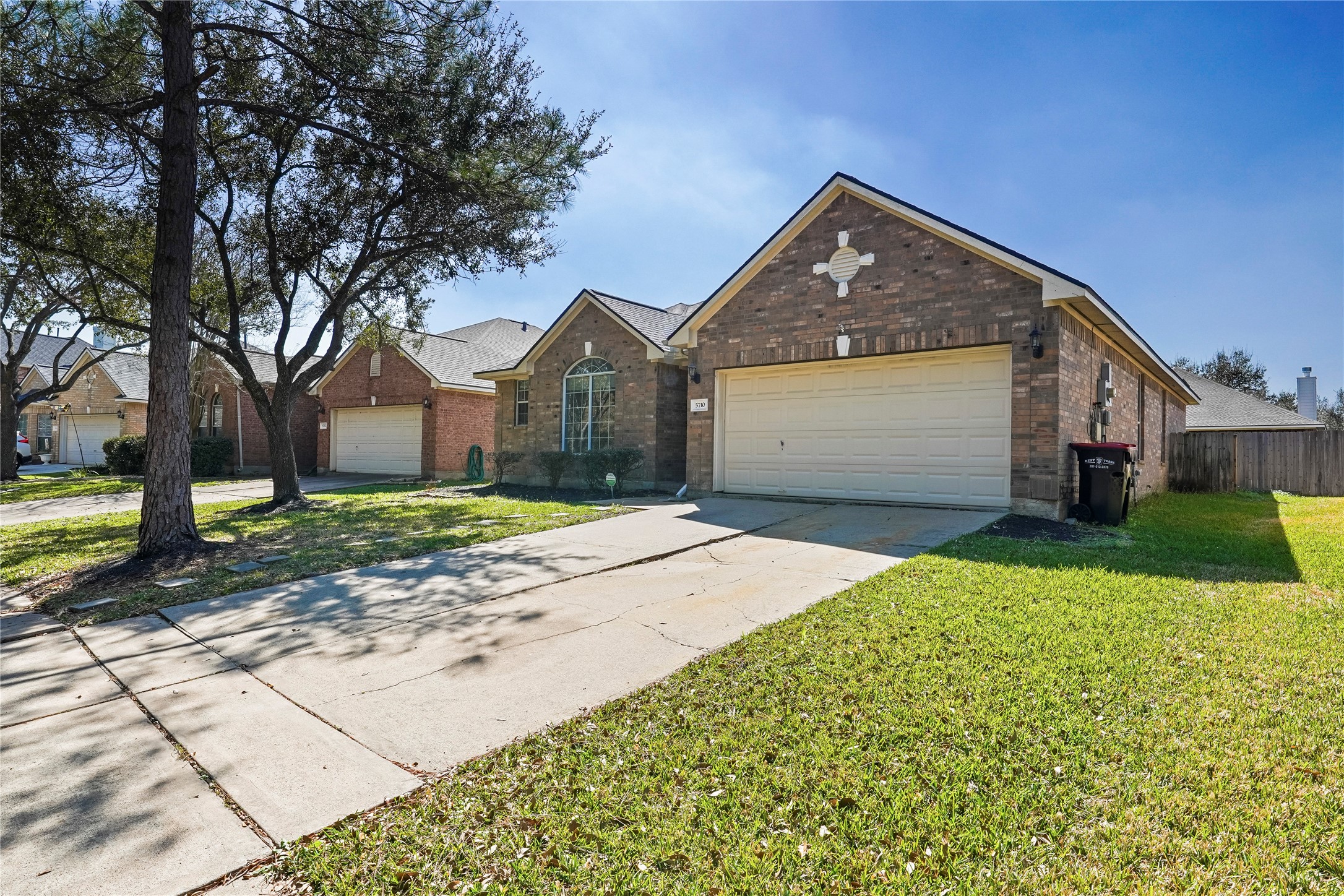 5710 Shady Hollow Court Rosharon, TX 77583 - Photo 25 of 25 a front view of a house with a yard and garage