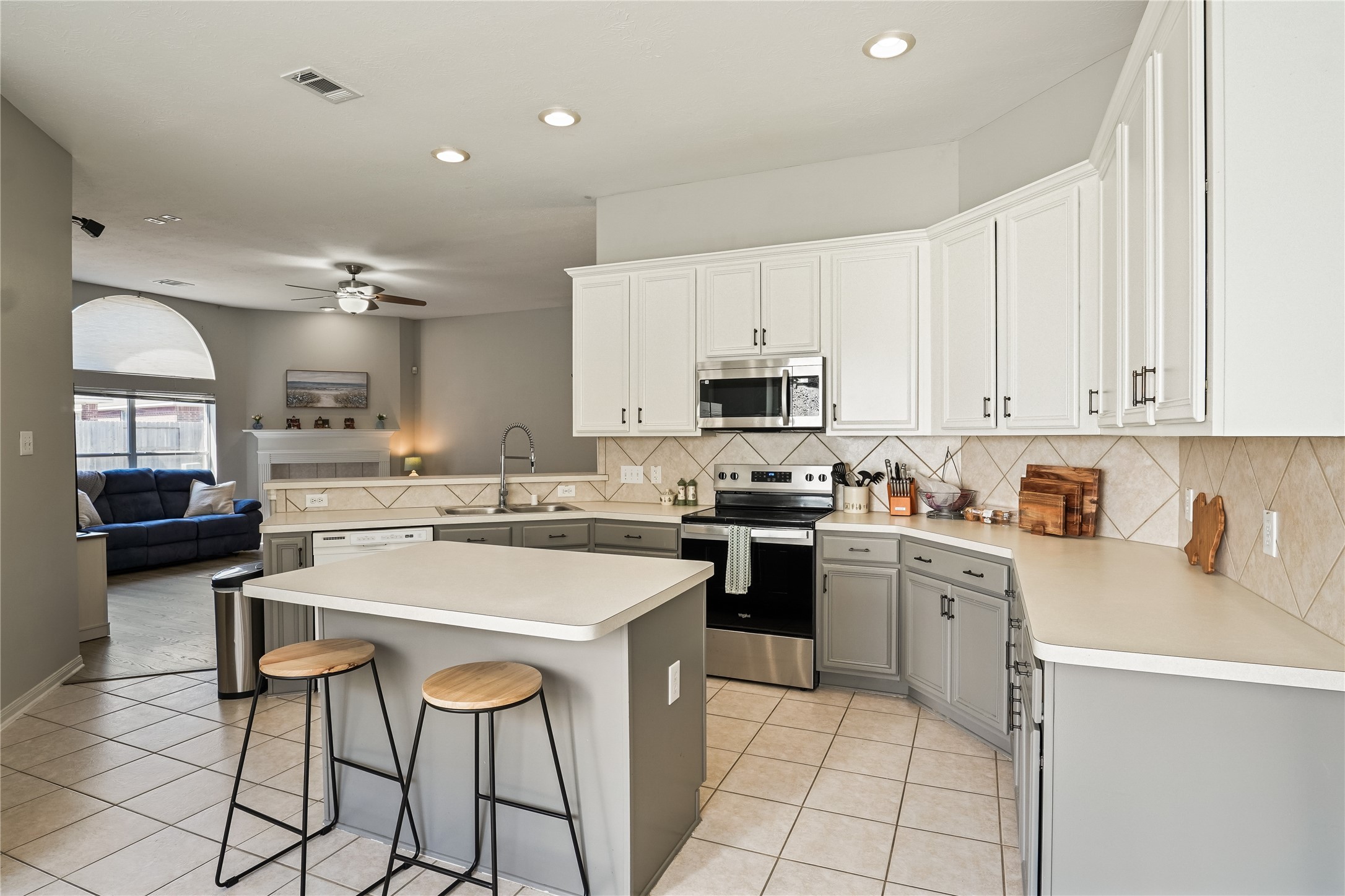5710 Shady Hollow Court Rosharon, TX 77583 - Photo 10 of 25 a kitchen with a sink a counter top space appliances and cabinets