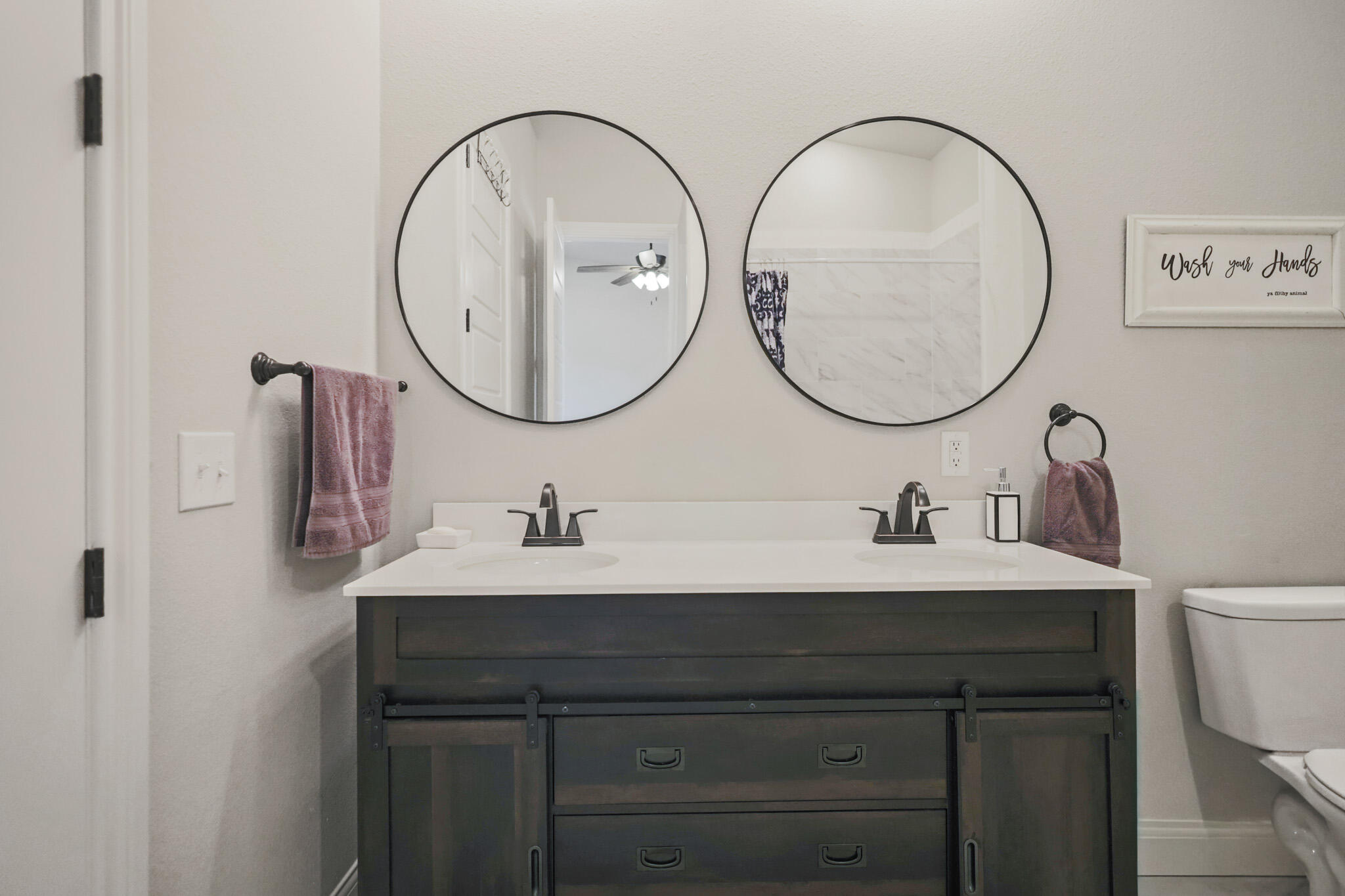 301 Fagan Road Snyder, TX 79549 - Photo 59 of 102 a bathroom with a sink a toilet and a mirror