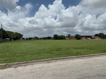 a view of a big yard with a house