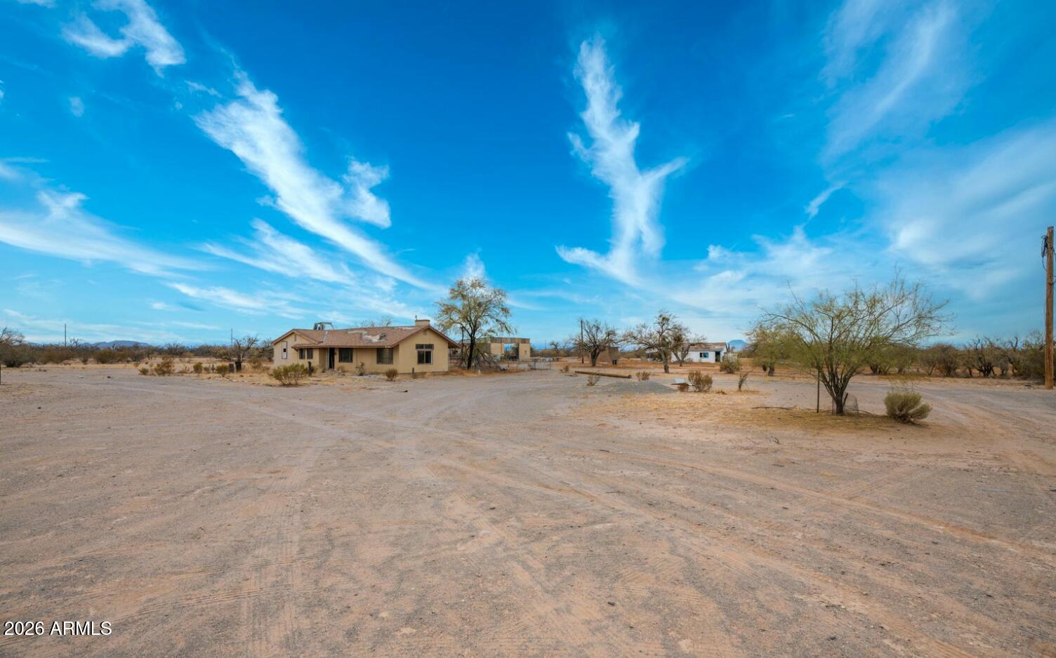 3838 South Verbena Road Casa Grande, AZ 85193 - Photo 6 of 6 a view of a road with a building in the background