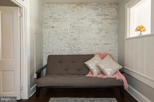 a view of bedroom with furniture and window