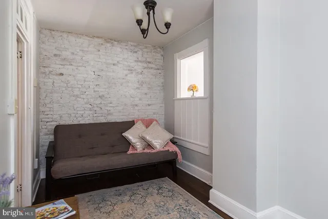 a living room with furniture and a rug