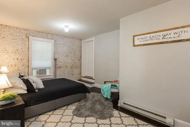 a bedroom with a bed and a table