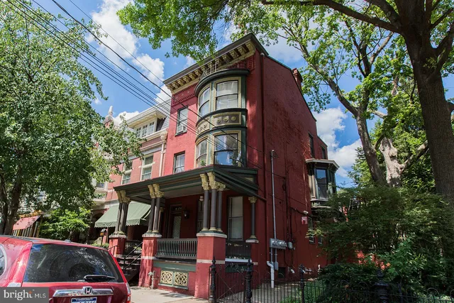a front view of a house with parking space
