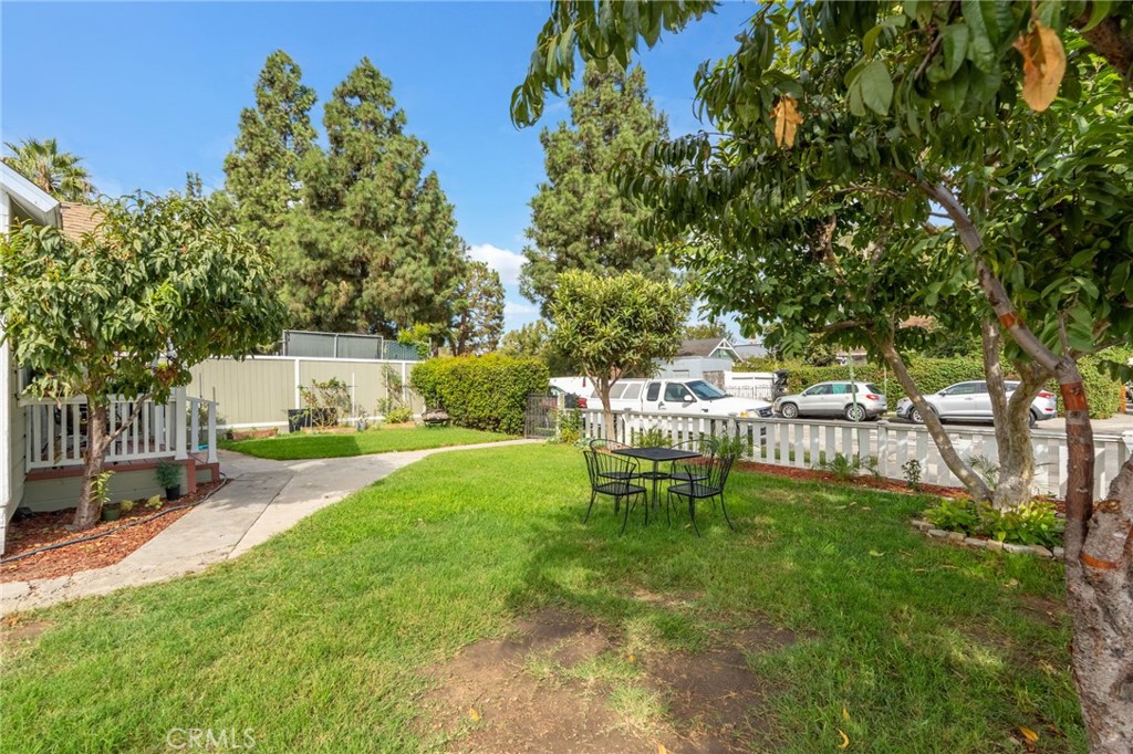 926 East Pine Street Santa Ana, CA 92701 - Photo 6 of 15 a view of a chairs and table in backyard