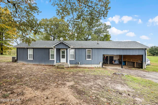 a house with trees in the background