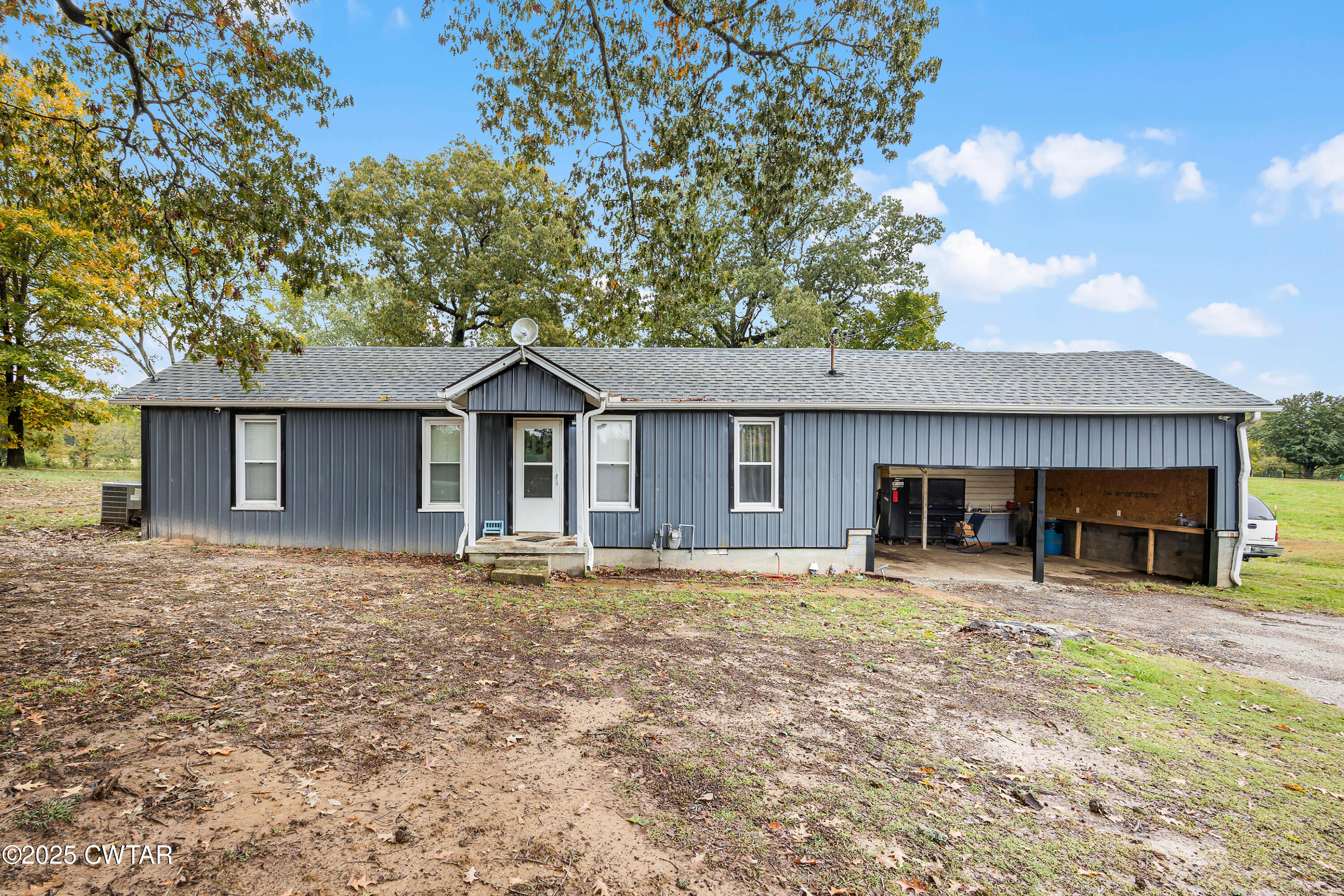 a house with trees in the background