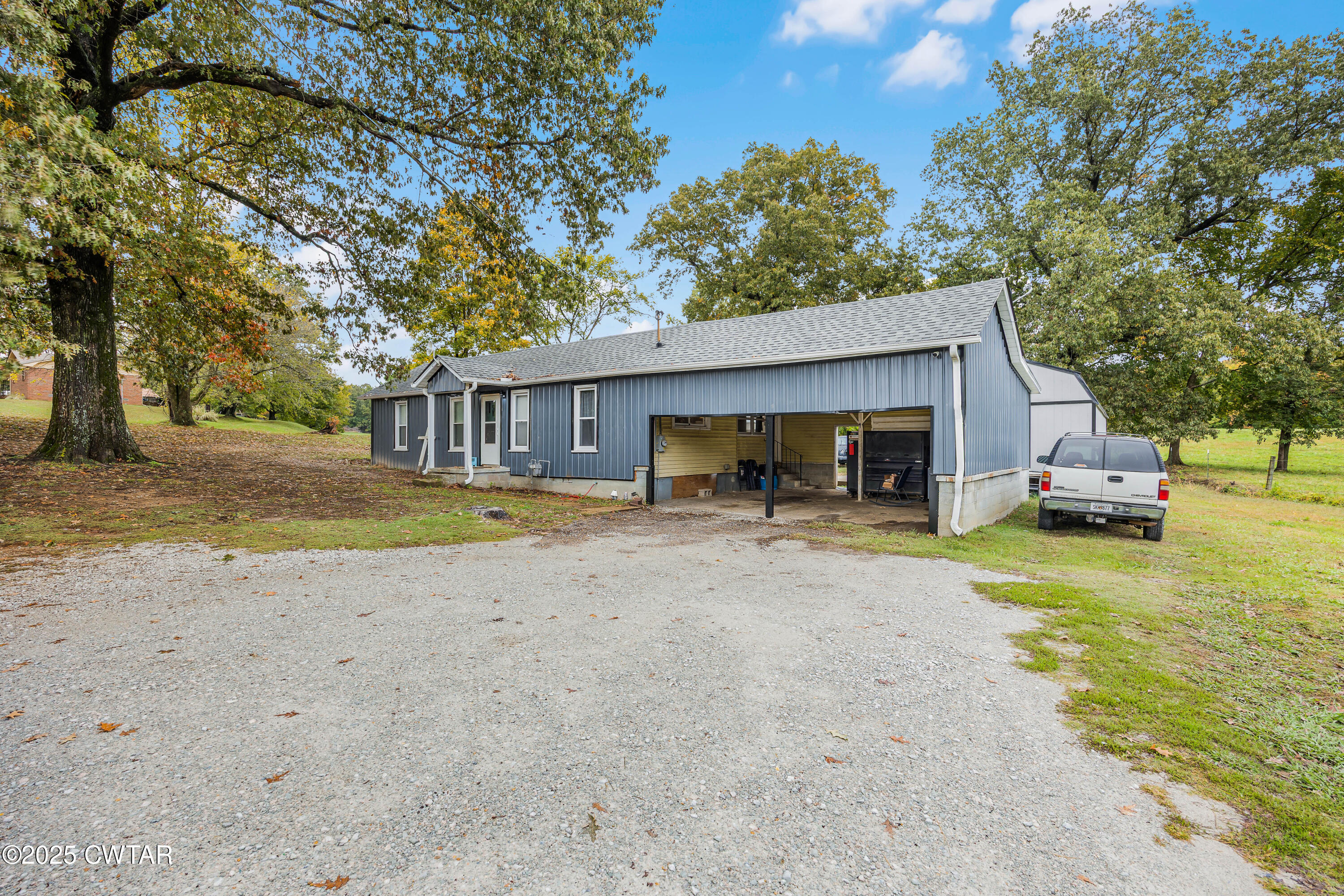 208 Germantown Road Milan, TN 38358 - Photo 12 of 16 a view of house with outdoor space and swimming pool