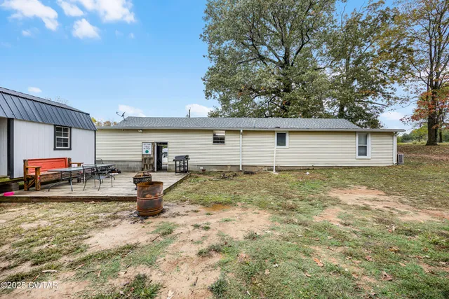 a view of a backyard with a sitting area