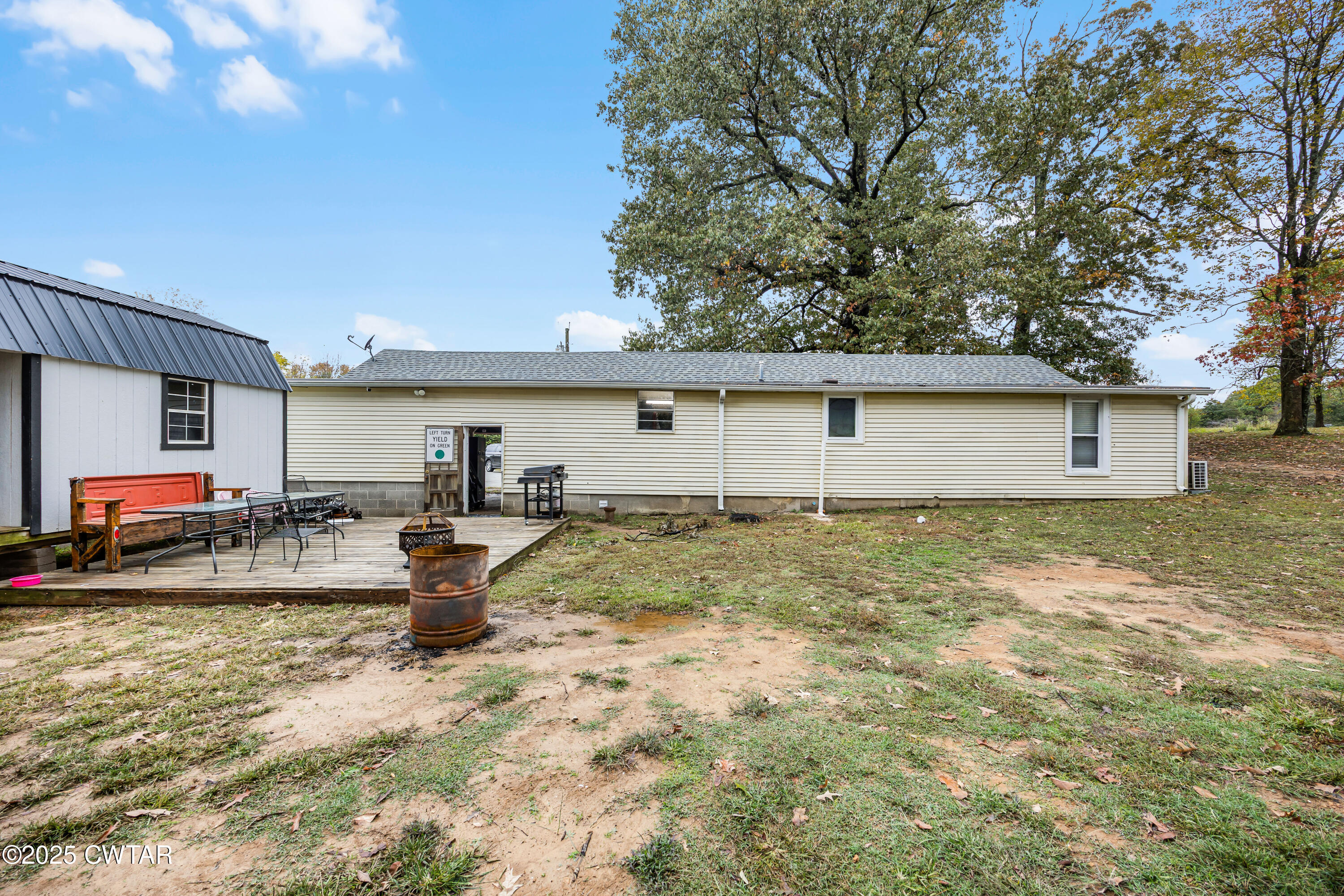208 Germantown Road Milan, TN 38358 - Photo 16 of 16 a view of a backyard with a sitting area