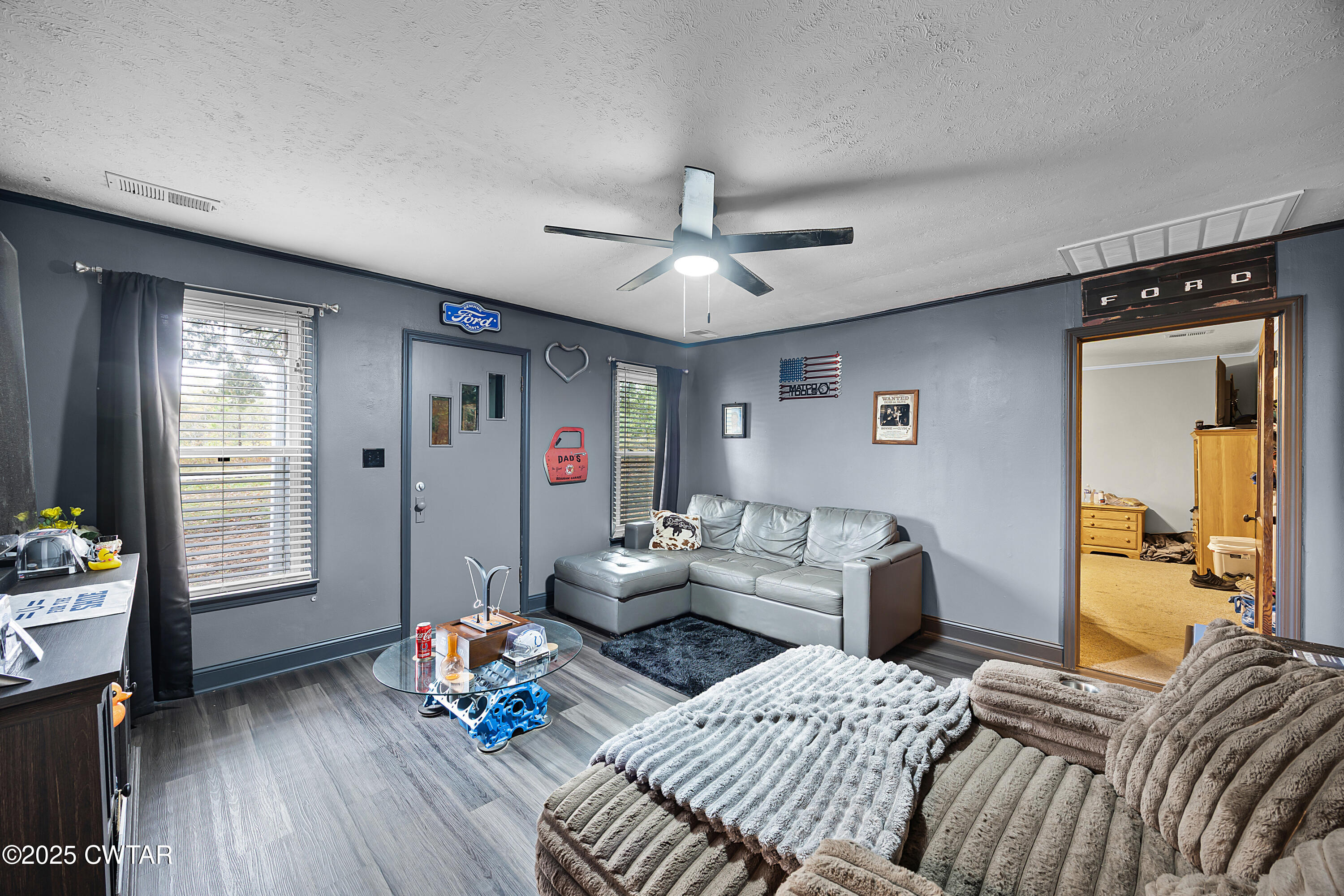 208 Germantown Road Milan, TN 38358 - Photo 2 of 16 a living room with furniture and a wooden floor