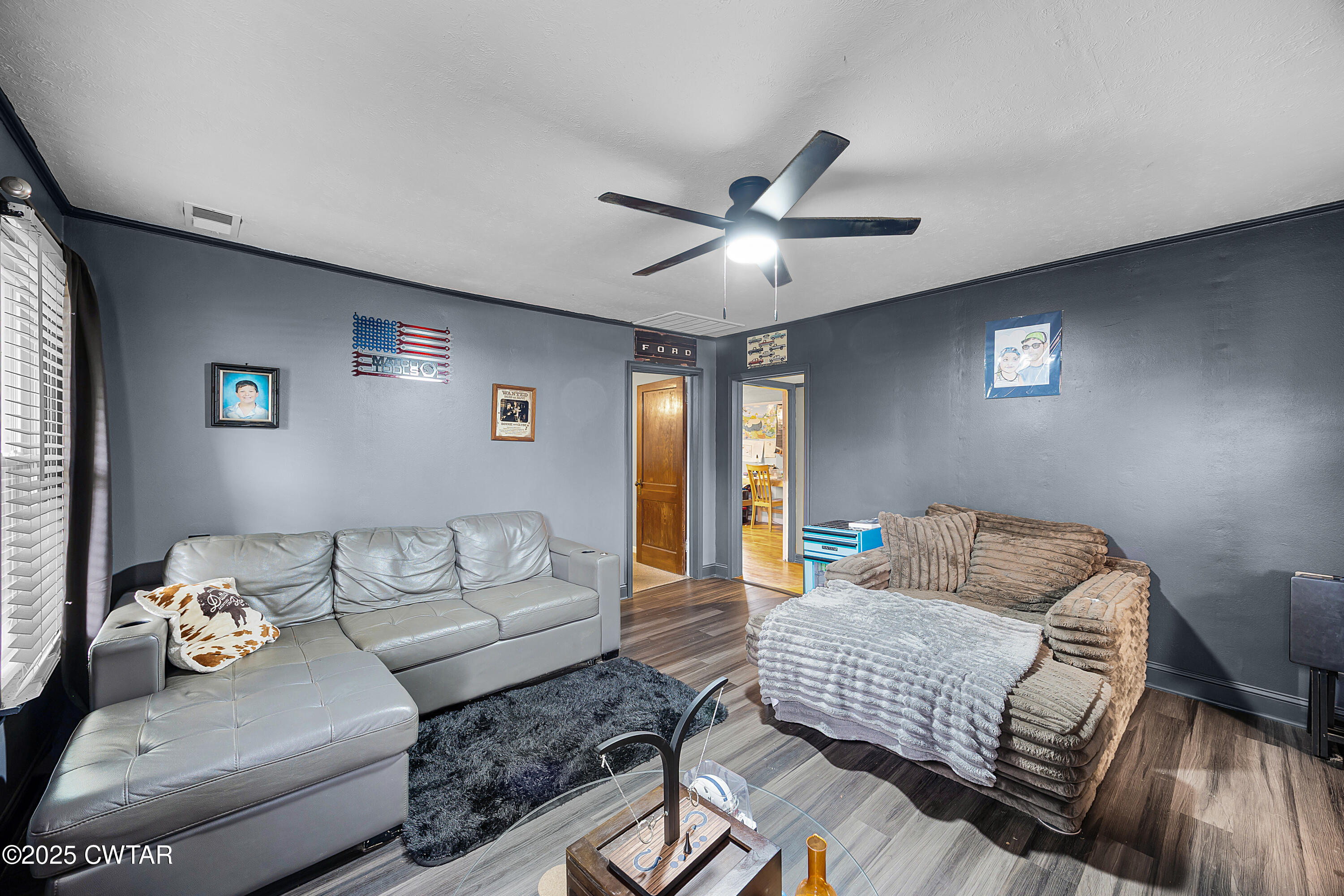 208 Germantown Road Milan, TN 38358 - Photo 4 of 16 a living room with furniture and a ceiling fan