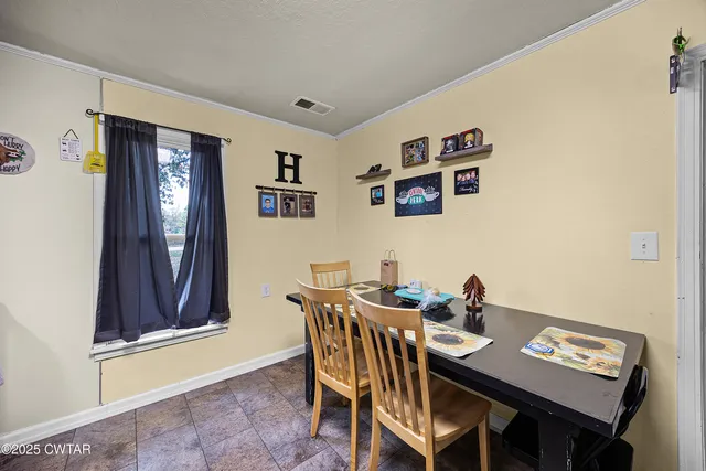 a view of a dining room with furniture