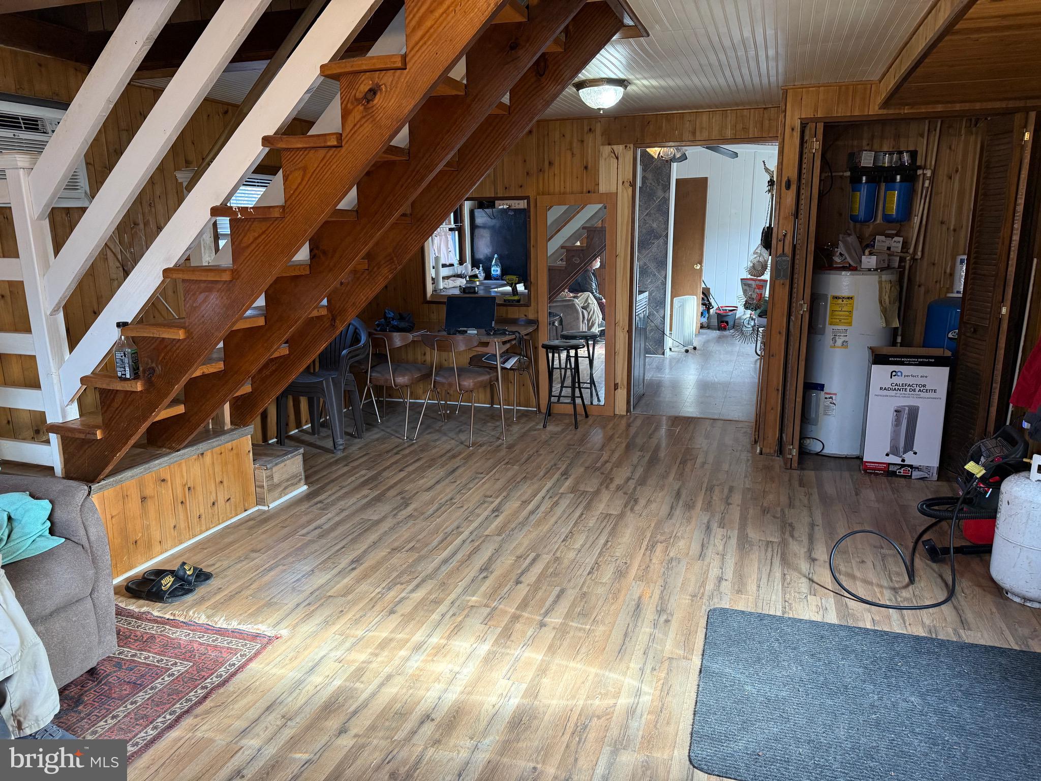 692 Plum Tree Lane Berkeley Springs, WV 25411 - Photo 5 of 14 a room with lots of wooden furniture and a view of bedroom