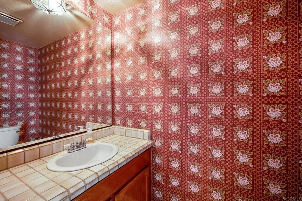 6882 Batiquitos Drive Carlsbad, CA 92011 - Photo 16 of 47 a bathroom with a sink and vanity