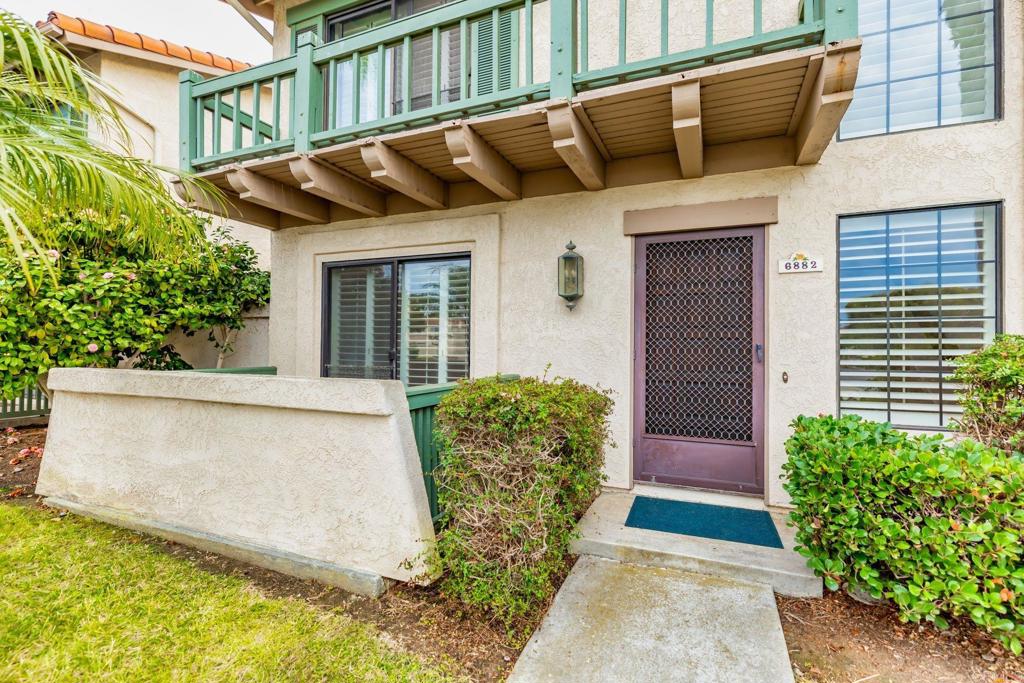 6882 Batiquitos Drive Carlsbad, CA 92011 - Photo 2 of 47 a view of a house with a large window and flower plants