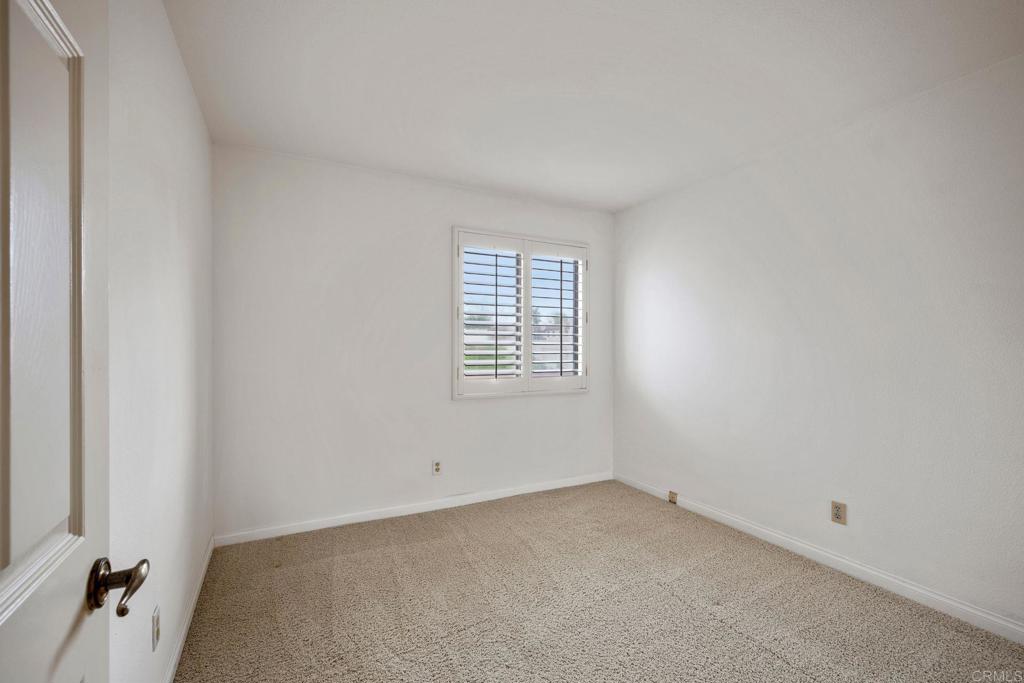 6882 Batiquitos Drive Carlsbad, CA 92011 - Photo 22 of 47 an empty room with windows