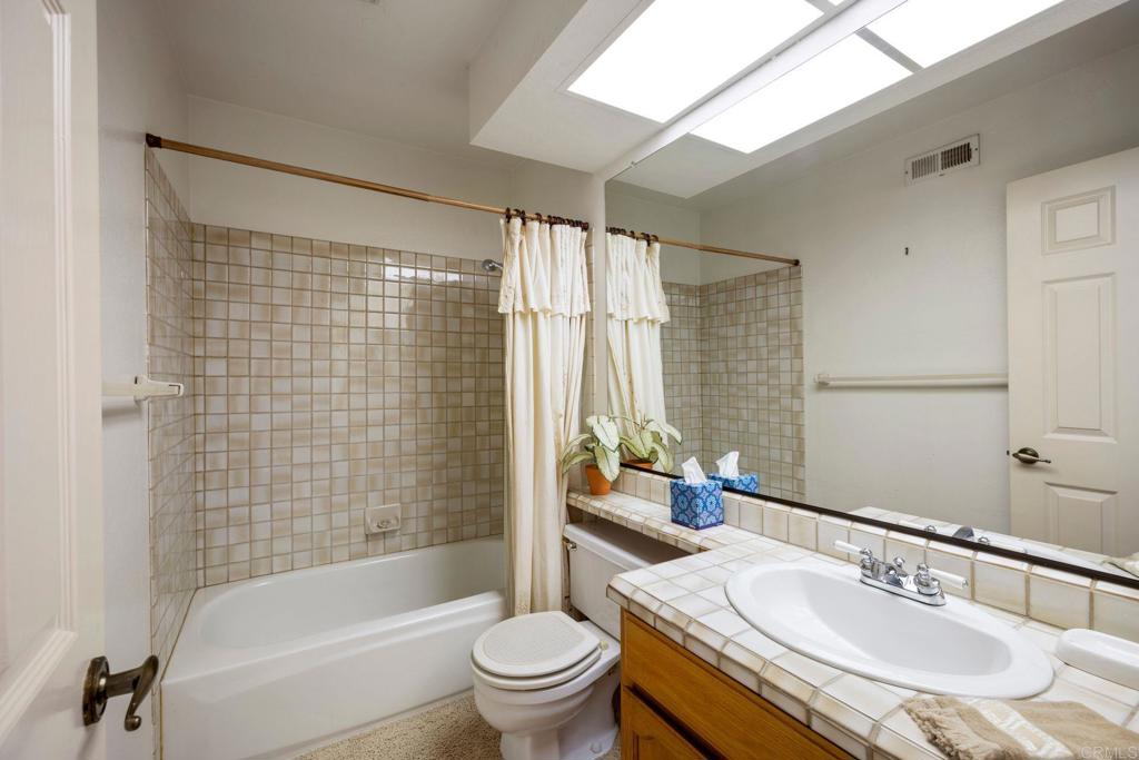 6882 Batiquitos Drive Carlsbad, CA 92011 - Photo 24 of 47 a bathroom with a sink toilet and shower