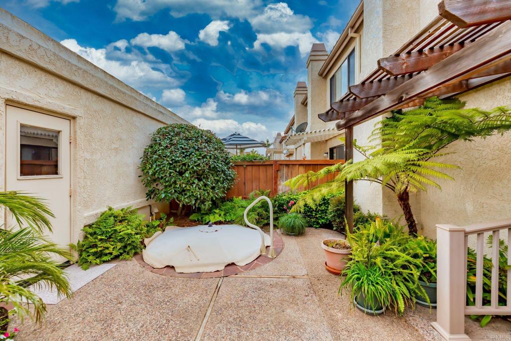 6882 Batiquitos Drive Carlsbad, CA 92011 - Photo 25 of 47 a view of a chair and table in the backyard