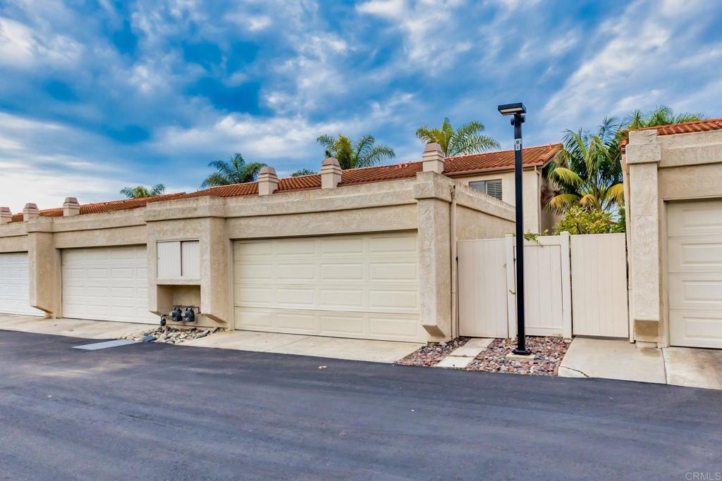 6882 Batiquitos Drive Carlsbad, CA 92011 - Photo 30 of 47 a view of a porch with a bench
