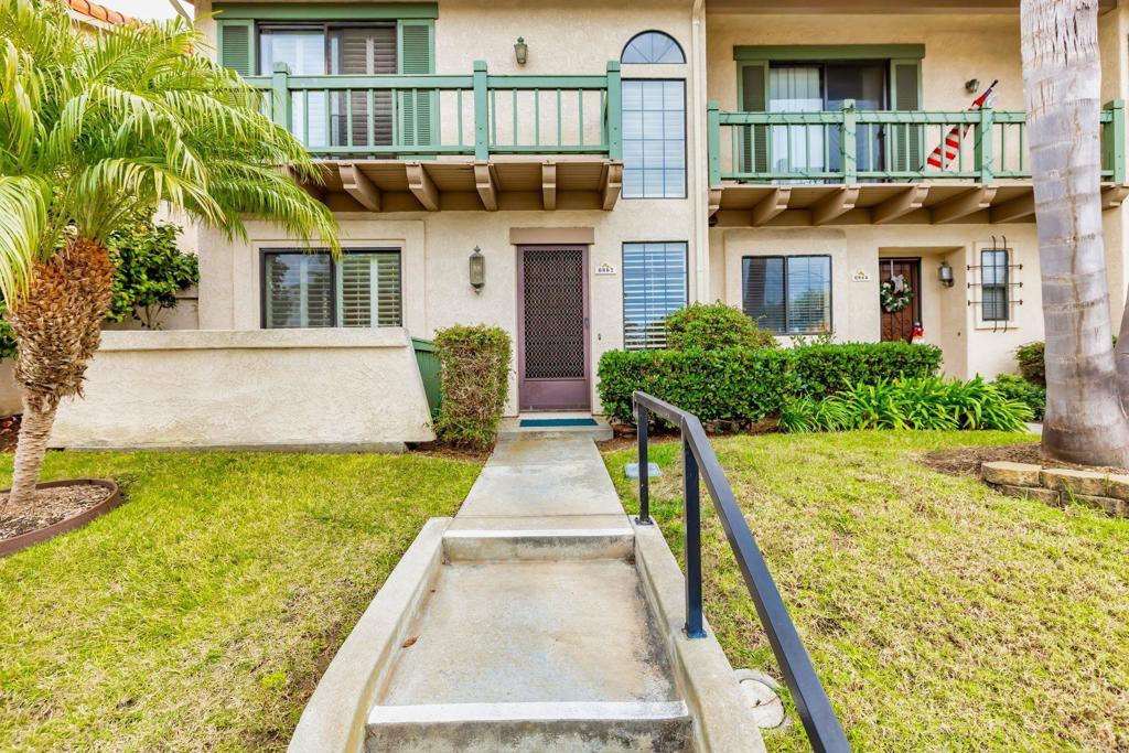 6882 Batiquitos Drive Carlsbad, CA 92011 - Photo 33 of 47 a front view of a house with a yard and potted plants