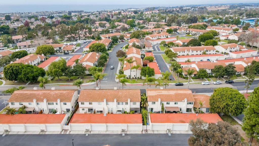 6882 Batiquitos Drive Carlsbad, CA 92011 - Photo 36 of 47 an aerial view of residential houses with outdoor space and parking