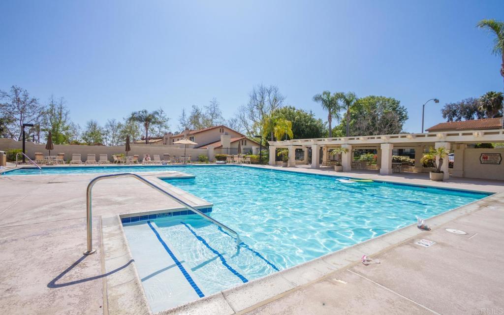 6882 Batiquitos Drive Carlsbad, CA 92011 - Photo 43 of 47 a view of a swimming pool with an outdoor seating and a garden