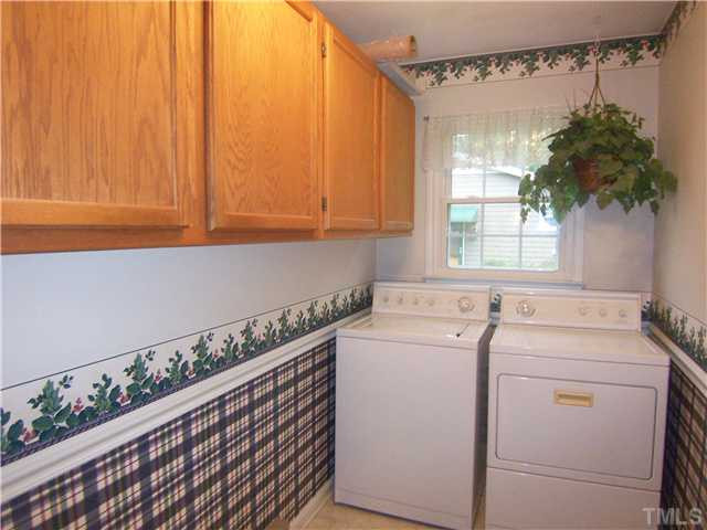 6915 Innesbrook Way Bahama, NC 27503 - Photo 12 of 15 a utility room with dryer and washer