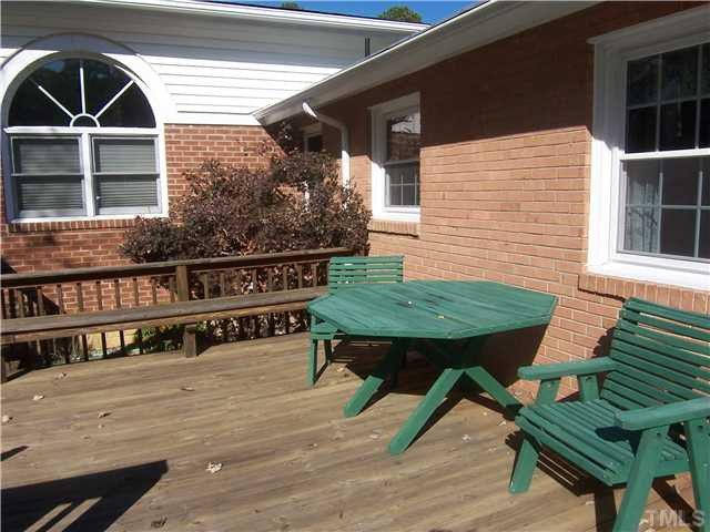 6915 Innesbrook Way Bahama, NC 27503 - Photo 14 of 15 a view of house with deck outdoor seating and kitchen view