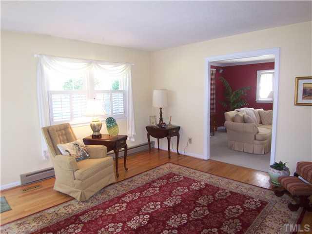 6915 Innesbrook Way Bahama, NC 27503 - Photo 2 of 15 a living room with furniture and a rug