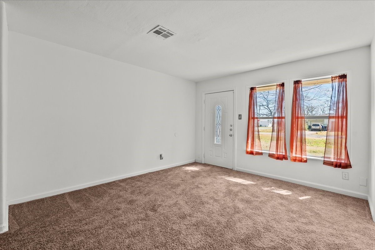 1002 Orange Street La Marque, TX 77568 - Photo 27 of 31 a view of an empty room with a window