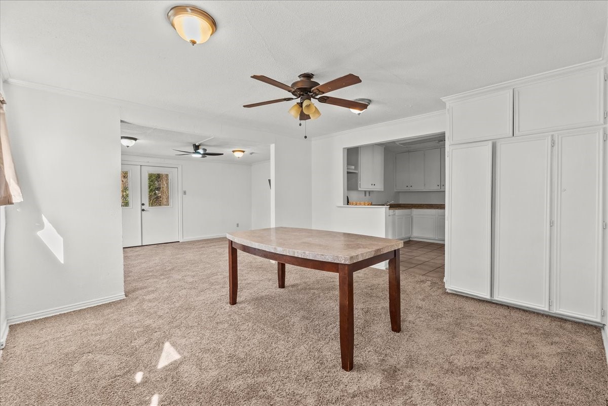 1002 Orange Street La Marque, TX 77568 - Photo 8 of 31 a view of a livingroom with furniture and a ceiling fan