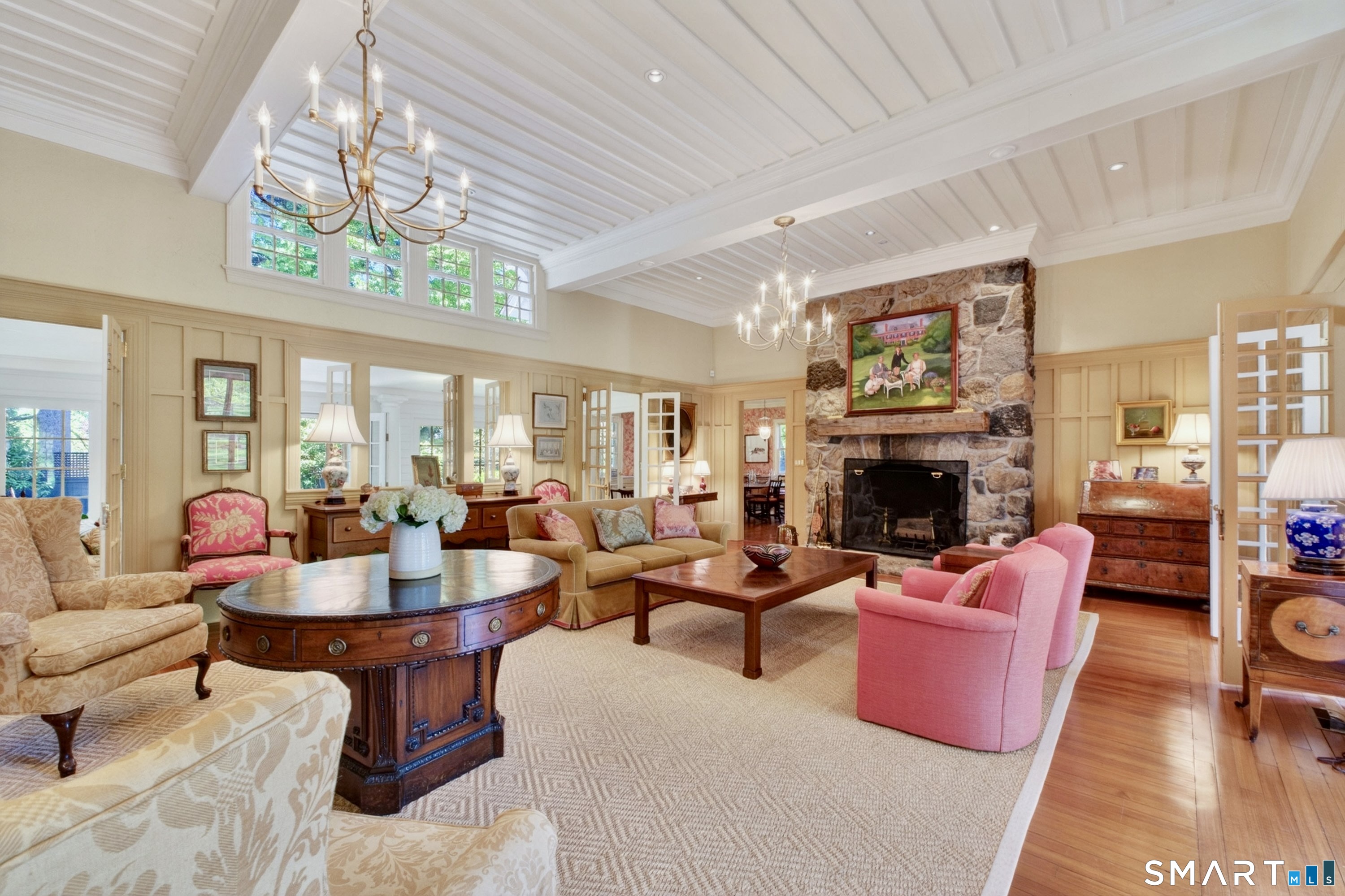 41 Peaceable Street Ridgefield, CT 06877 - Photo 5 of 40 a living room with furniture a fireplace and a chandelier