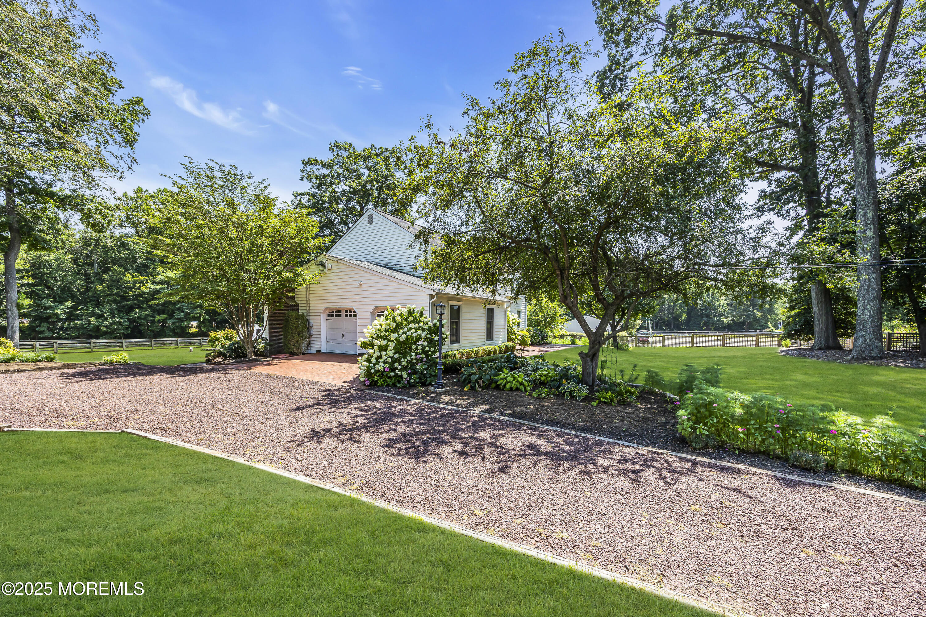 39 Hockhockson Road Colts Neck, NJ 07722 - Photo 11 of 72 a view of a backyard with a garden
