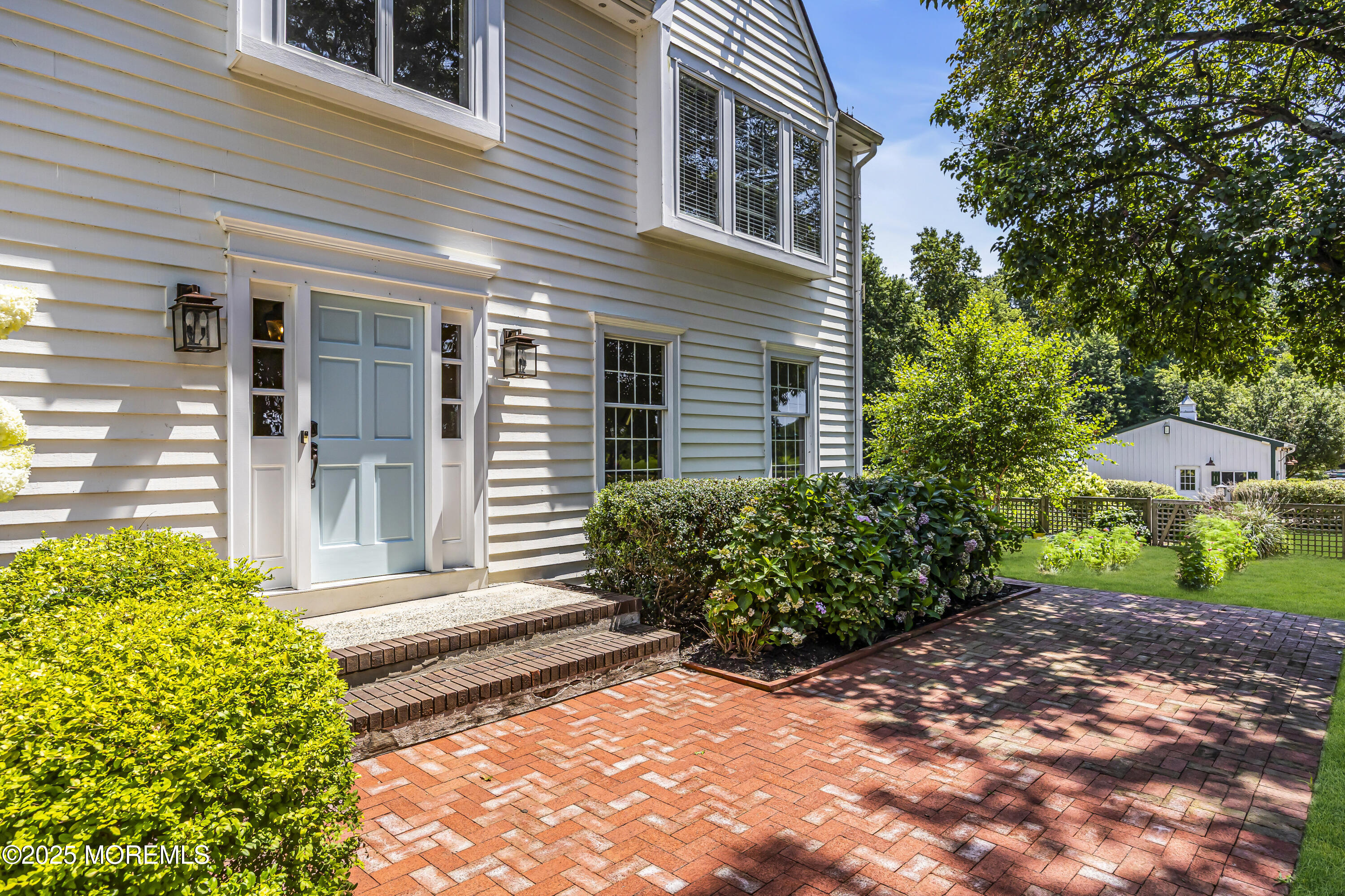 39 Hockhockson Road Colts Neck, NJ 07722 - Photo 12 of 72 a view of a house with potted plants