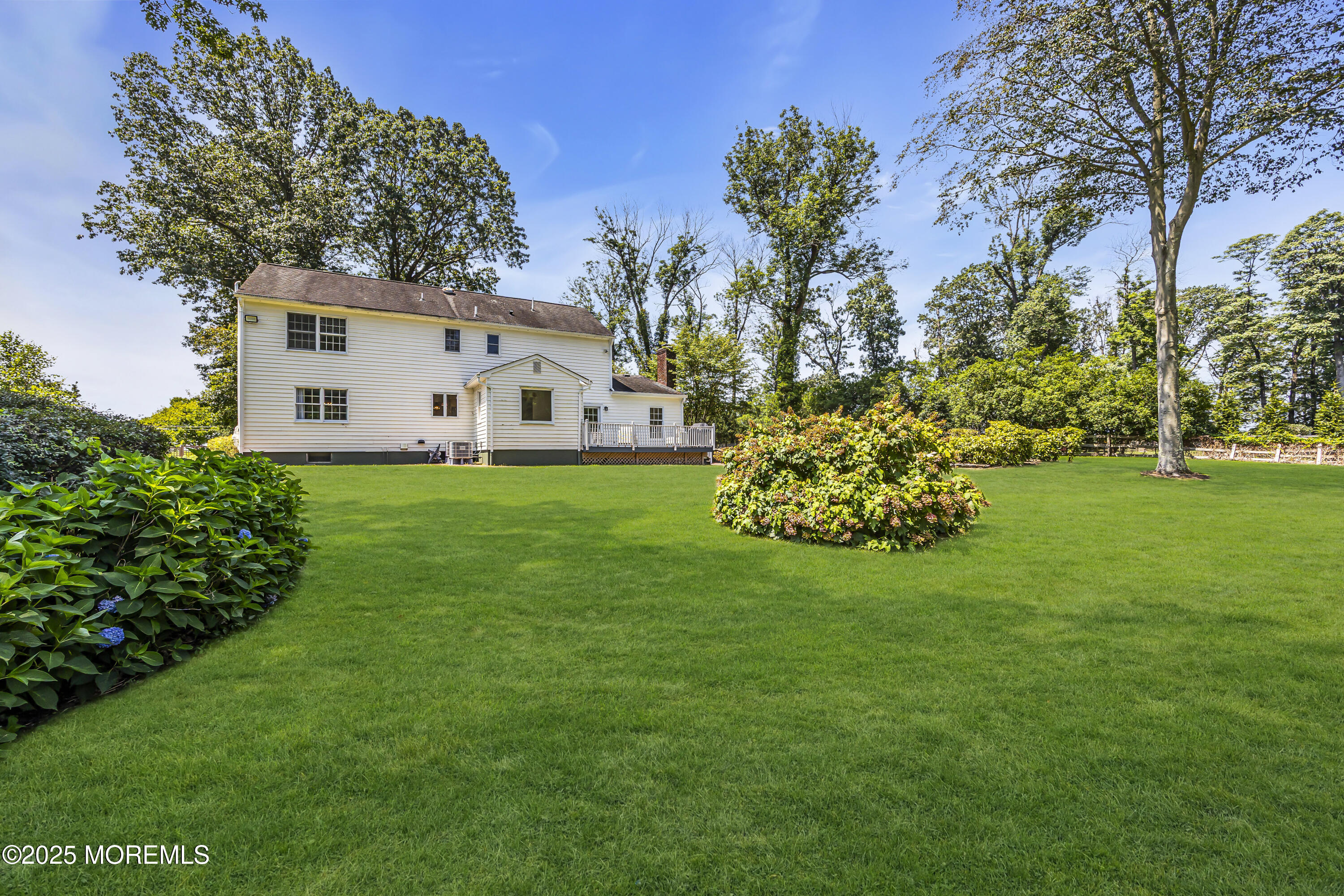 39 Hockhockson Road Colts Neck, NJ 07722 - Photo 15 of 72 a front view of a house with garden