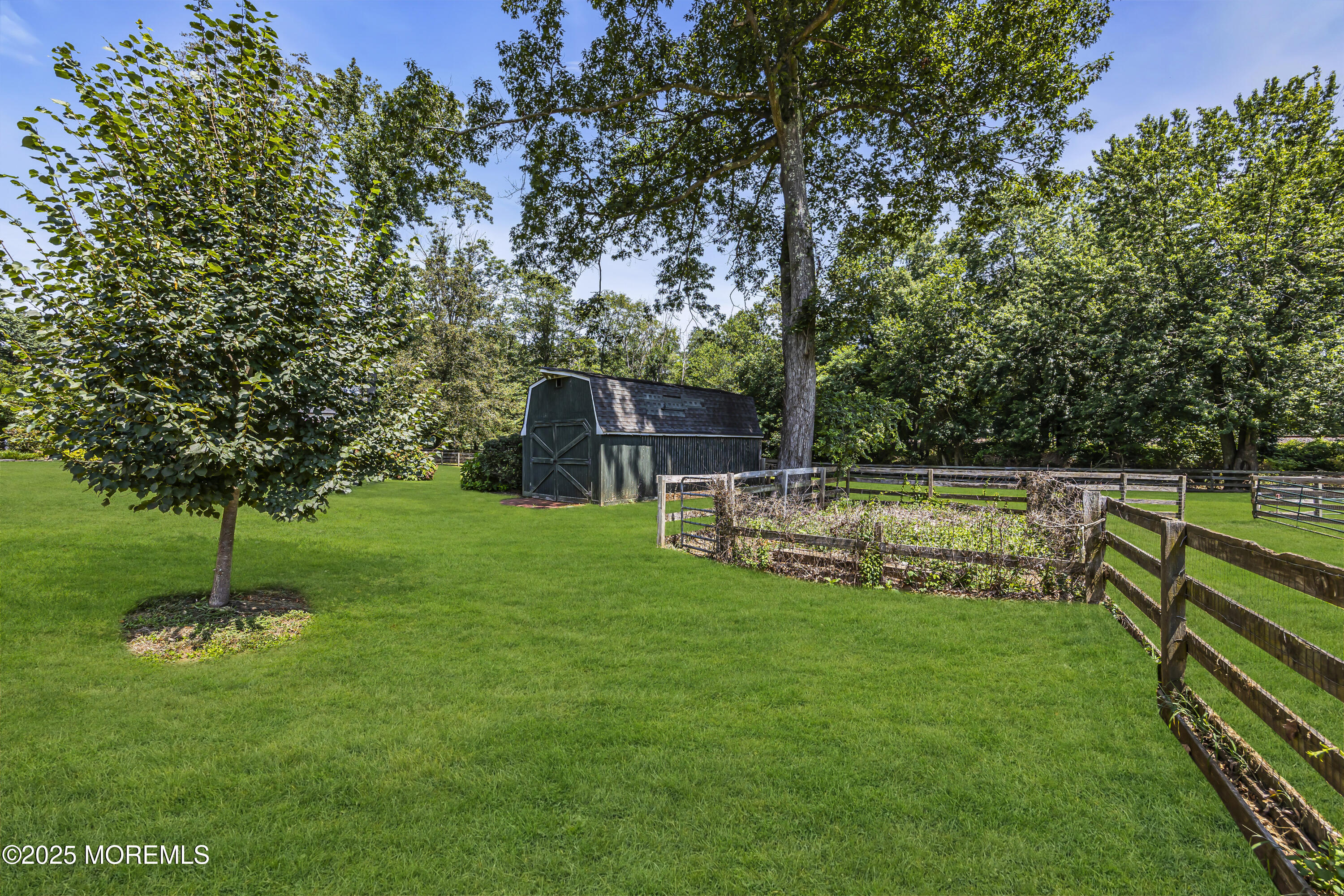 39 Hockhockson Road Colts Neck, NJ 07722 - Photo 17 of 72 a view of house with a backyard
