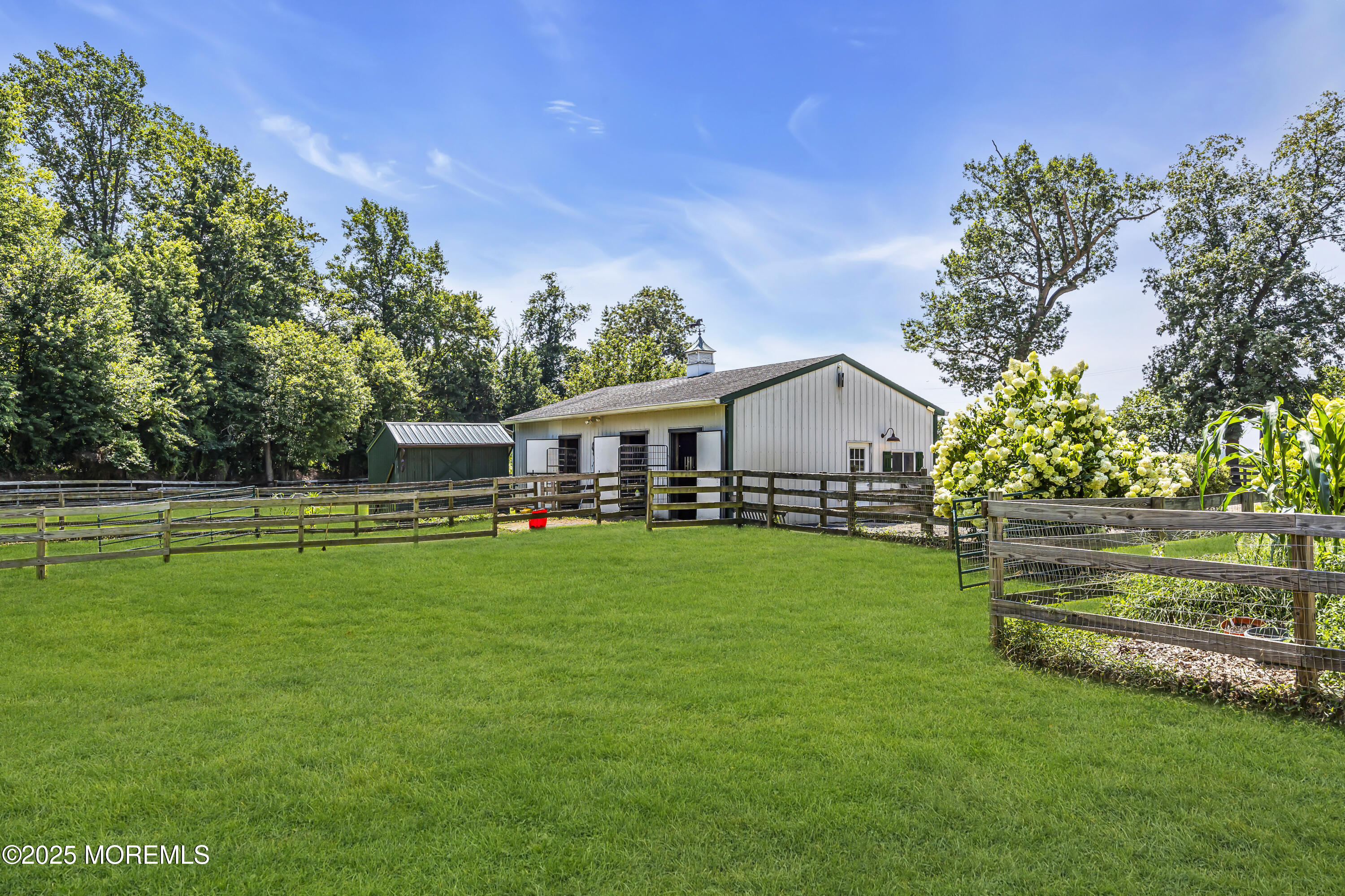 39 Hockhockson Road Colts Neck, NJ 07722 - Photo 18 of 72 a front view of a house with garden