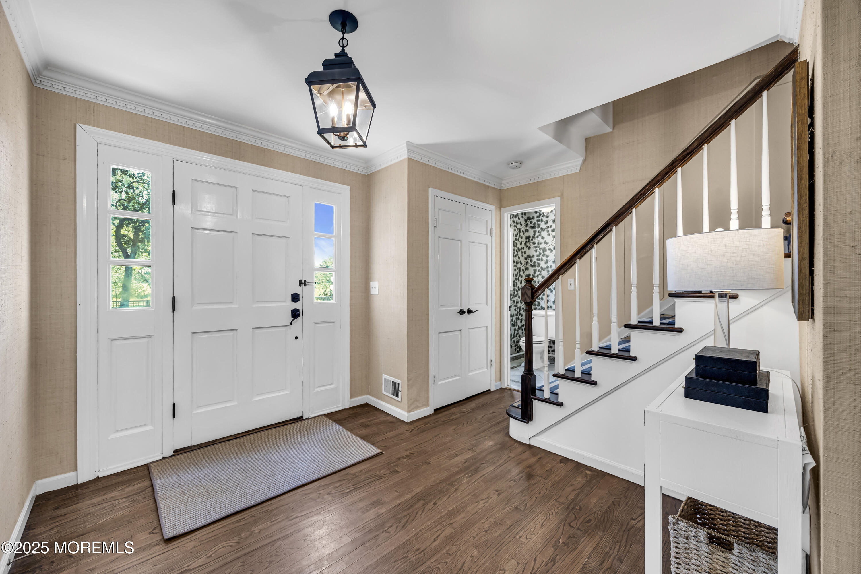 39 Hockhockson Road Colts Neck, NJ 07722 - Photo 19 of 72 a view of entryway and hall with wooden floor