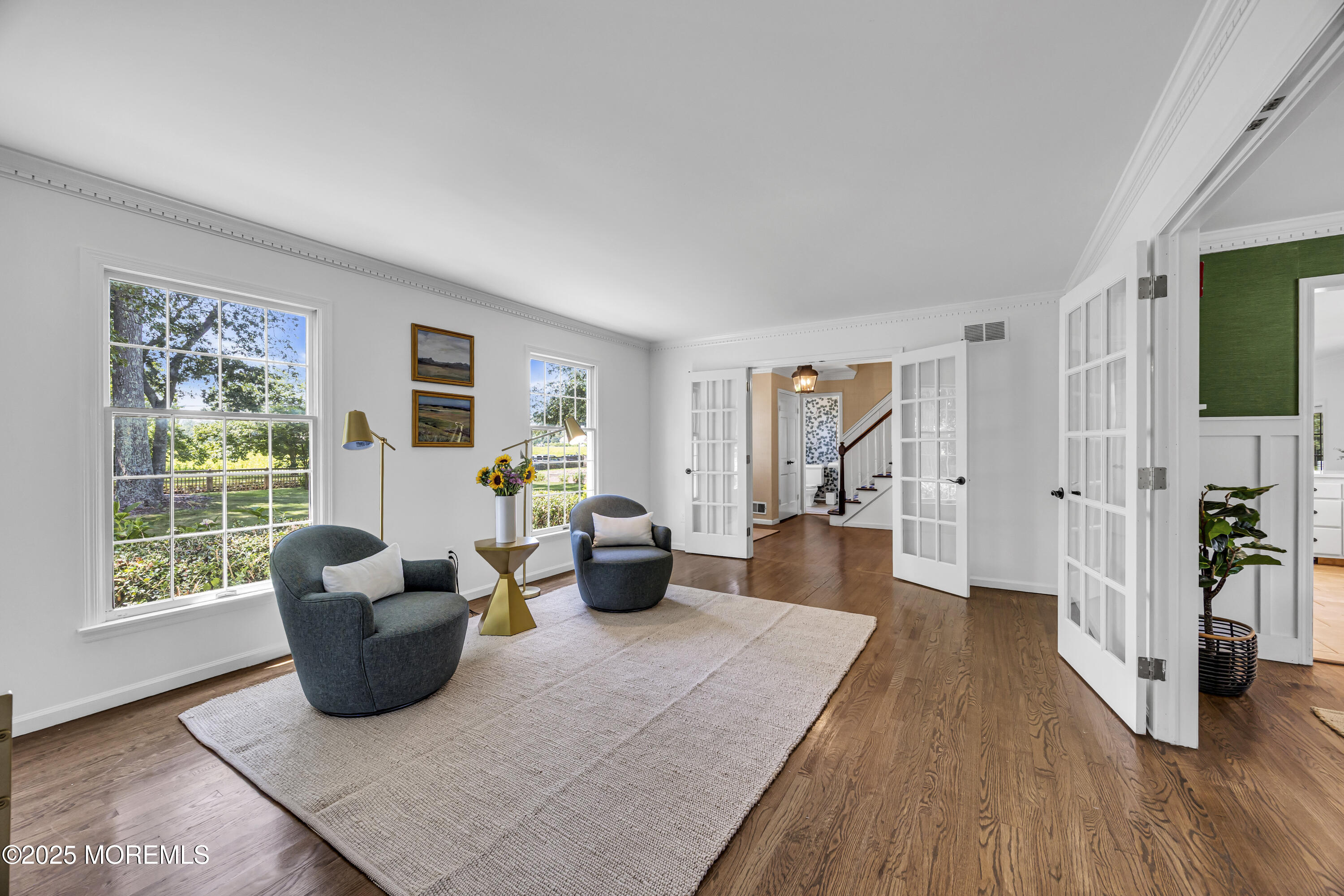 39 Hockhockson Road Colts Neck, NJ 07722 - Photo 24 of 72 a living room with furniture and a flat screen tv