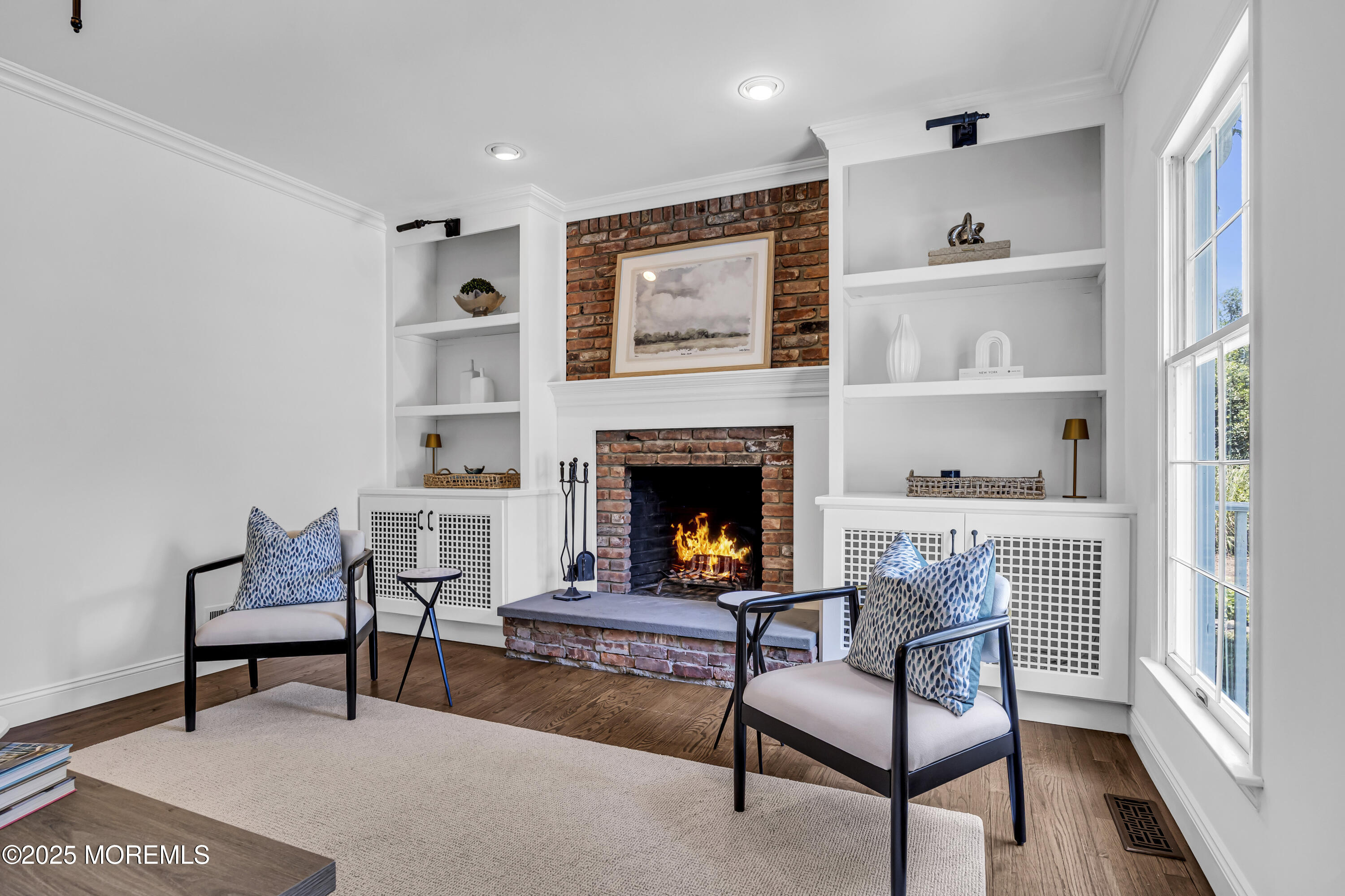 39 Hockhockson Road Colts Neck, NJ 07722 - Photo 35 of 72 a living room with furniture and a fireplace