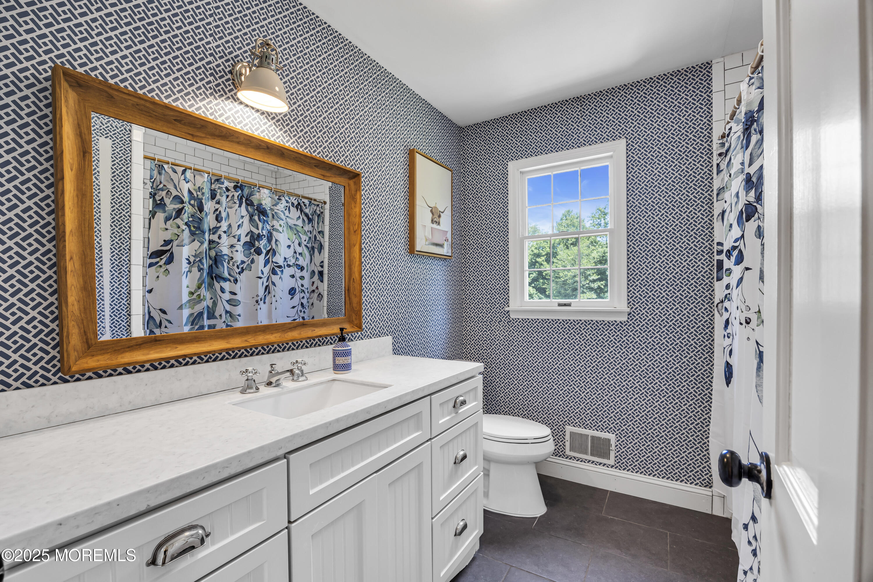 39 Hockhockson Road Colts Neck, NJ 07722 - Photo 43 of 72 a bathroom with a sink a toilet and a window