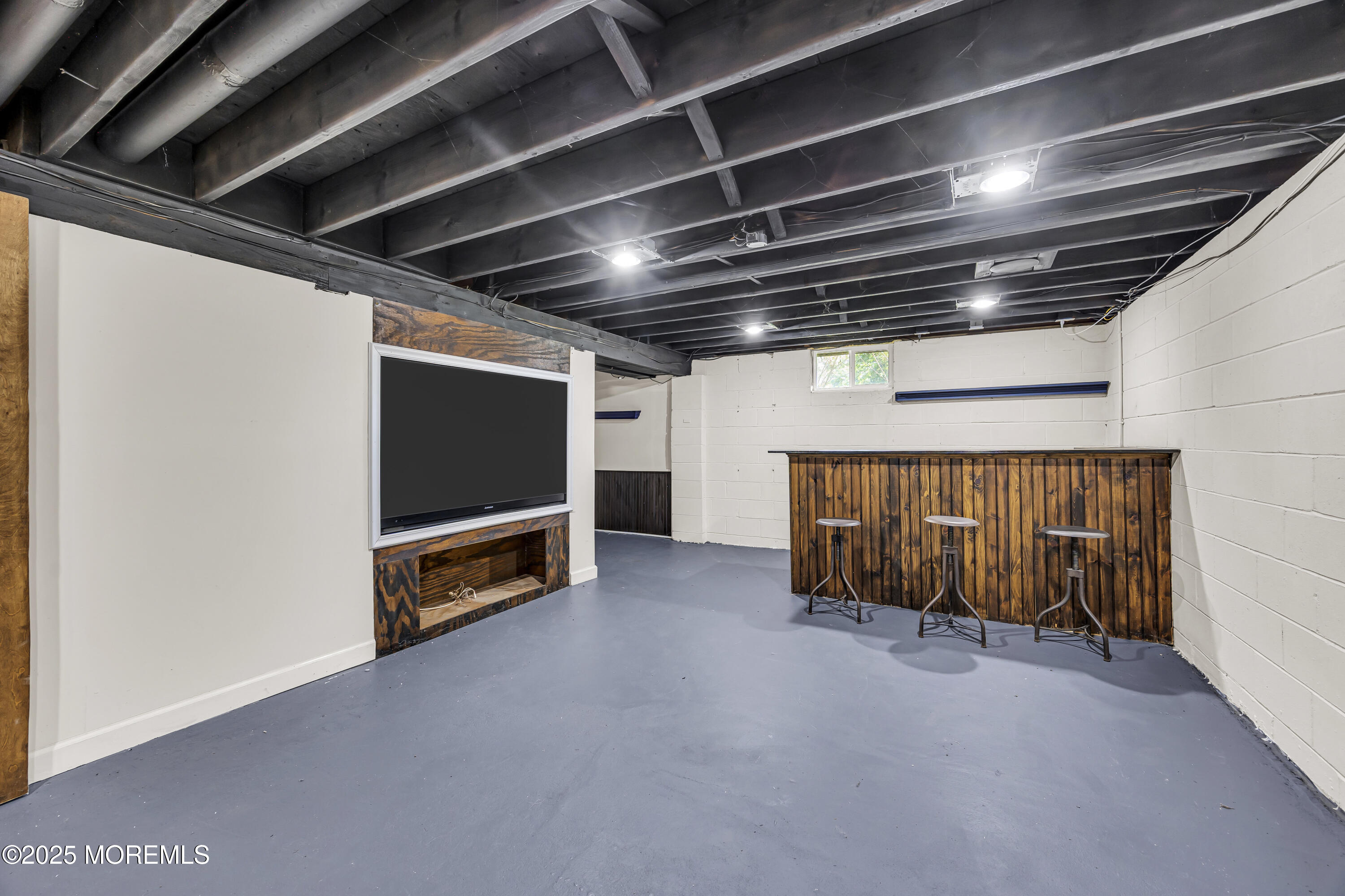 39 Hockhockson Road Colts Neck, NJ 07722 - Photo 52 of 72 a view of an empty room with furniture and a ceiling fan